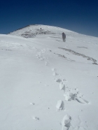 Nearing the summit in high winds.