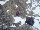 Tom and Sean down-climbing the chimney.