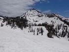 Michael heading down the bowl, Mount Baird in the background.