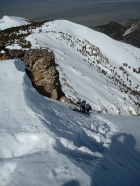 Snow climbing past the second obstacle on the ridge.