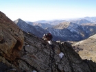 This is Sean tiptoeing along a slot, an early Class 3+ move on the south ridge.