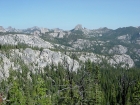 Craggy terrain as seen from early in the approach. Visible in the distance are Fishfin Ridge, Mount McGuire, and Cathedral Rock.