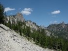 Me on the trail leading up the Heart Lake, with Fishfin Ridge in the background to the right.