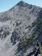 Here's Ken perched on the ridge, with Sheepeater Mountain (9920') behind him to the northeast.