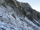 Pat climbing cautiously up the icy chute.