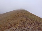 The summit of Cayuse Peak in the clouds.