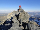 Sean peering off the summit of Clyde Minaret.