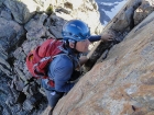 Sean re-climbing the class 4 section on the way back. Steep drop to his right.