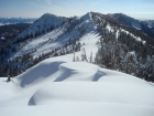 Descending the southeast ridge, with Castle Peak in the distance.