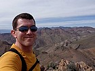 Me on the summit of Corkscrew Peak, with Thimble Peak in the background.