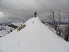 Crossing a cornice along the ridge between the two peaks.