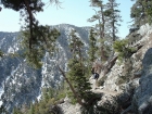 Matthew on the trail after Icehouse Saddle, Cucamonga Peak behind him.