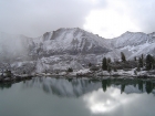 A dusting of snow on the mountains to the east, with Lake 9840' in the foreground.