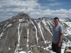 Dave on the summit of DBW with the massive Devils Bedstead East in the background.