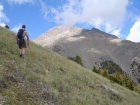 Jordan crossing the wildflower covered slopes early in the climb.