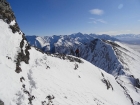 Sean nearing the base of the gully, Mount Borah in the background.