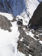 View from the top of the gully, Sean trying to find stable rock.