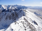 Sean nearing the summit of Dickey Peak, Borah Peak in the background.