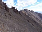 Following sheep trails on the east side of the ridge, Horseshoe Peak in the distance.