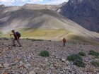 Heading up the talus slopes from the saddle.