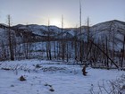 Looking back at the sun rising above the trailhead.