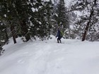 Sliding back down a steeper section of the ridge.