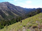 Headed up Consolation Peak, Galena Gulch in the background.