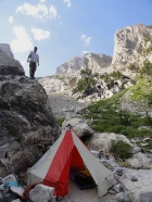 Chris above his sweet tent, Spalding Falls in the background.