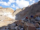 Taking a break on the moraine, Sky Top Glacier in the background.