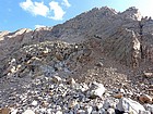 Southwest face of Granite Peak. Our first target is the black area on the left side of the huge granite slab.