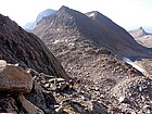 Hiking up from the saddle, Cairn Mountain in the background.