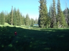 Hiking through grass above the lower lake.