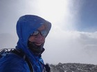 Getting blasted by snow on the summit of Torreys Peak.