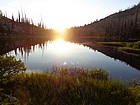 Sun going down behind Hard Creek Lake.