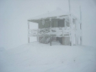 Frozen lookout building on the summit of Mount Harrison.