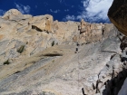 Sean taking advantage of the rope for a quick rappel down the slabs.