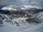 A view down into the cirque, with the northern Lost Rivers in the background. Visible are Dickey, Petros, Pavlos, Gooseberry, Trinity, Grouse Creek Mtn, etc.