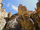 Surrounded by tall rock walls.