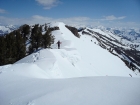 John crossing over some good sized cornices on the northeast ridge.