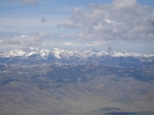 The snow covered Pioneer Mountains can be seen to the southwest.