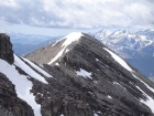 John making his way across the ridgeline as George approaches the false summit.