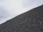 This is George glissading down the step snowfield from the west ridge. John is in the upper right scree skiing.