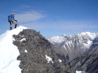 George on the pointy summit of Little Mac, Lost River Peak is to the right.