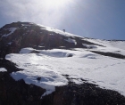 Pat climbing into the sun on the Mount McCaleb's west ridge.