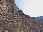 The route goes below these cliffs.