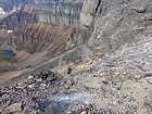 View down from above the crux, multiple groups of climbers below.