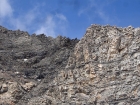 Close up of a mountain goat on the jagged ridge between Cobb and Old Hyndman.