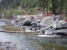 John crossing the footbridge over the Payette River.