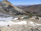 Steve climbing toward the east ridge of Pegasus Peak, Lost River Range in the distance.