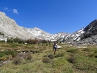 Steve hiking out of Surprise Valley, Altair Peak is just left of center.